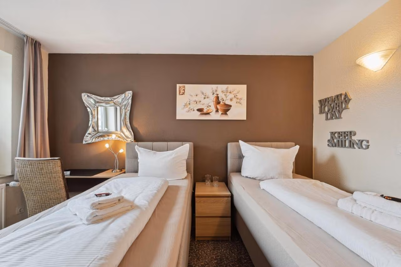 Doppel- oder Zweibettzimmer